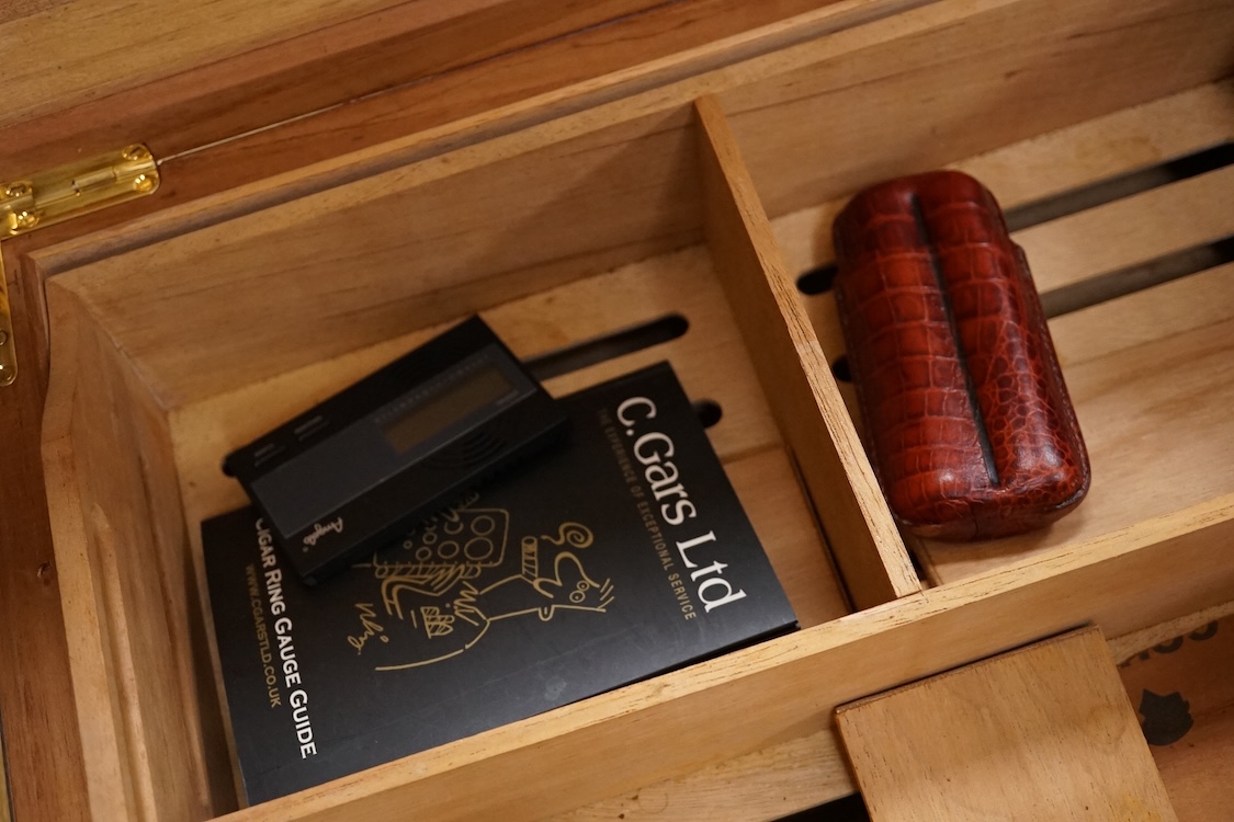A humidor ‘Hand Made Havana Cigars’, with double cigar pouch, with key, 44cm wide